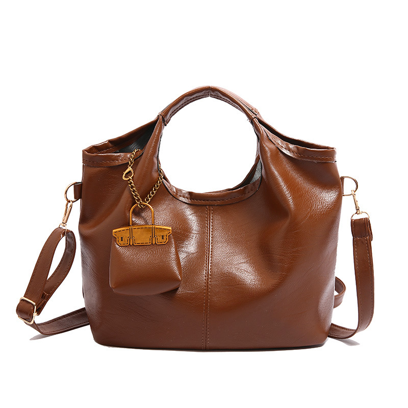 Bolsa de cubo retro 2024 nueva bolsa de hombro de gran capacidad, bolso de nicho elegante, bolso de cuero suave