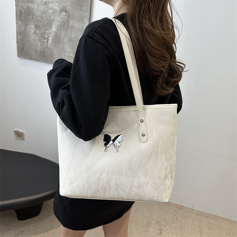 Alta sensación de plata tote2024 nuevo estudiante de gran capacidad arco brazo bolso de brazo versátil bolso de viaje