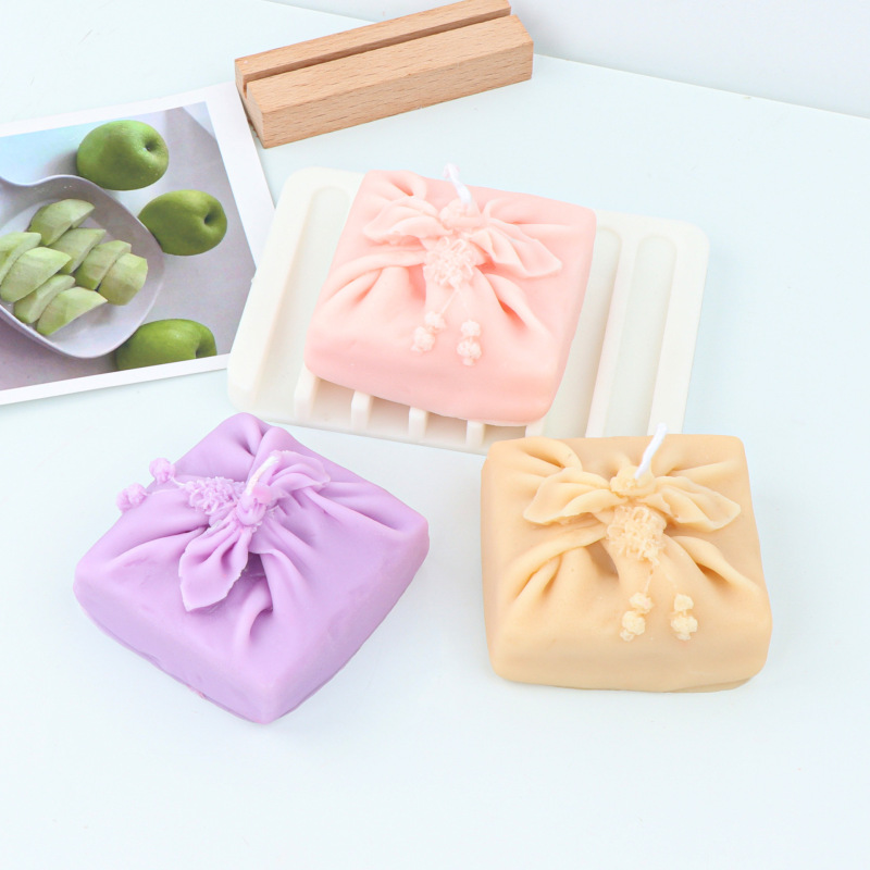 クリスマスの蝶結びのプレゼントの箱のろうそくの型diyの口の贈り物の箱のろうそくの型のシリカゲルのゴムの石膏は砂糖の型をひっくり返します。|undefined