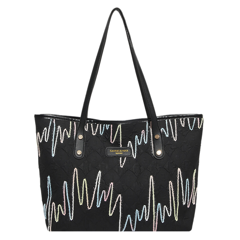 Bolsas de tela de clase de estudiantes para mujeres 2025 nuevo hombro brazalete estriado de gran capacidad de viaje ocio bolsa de mano