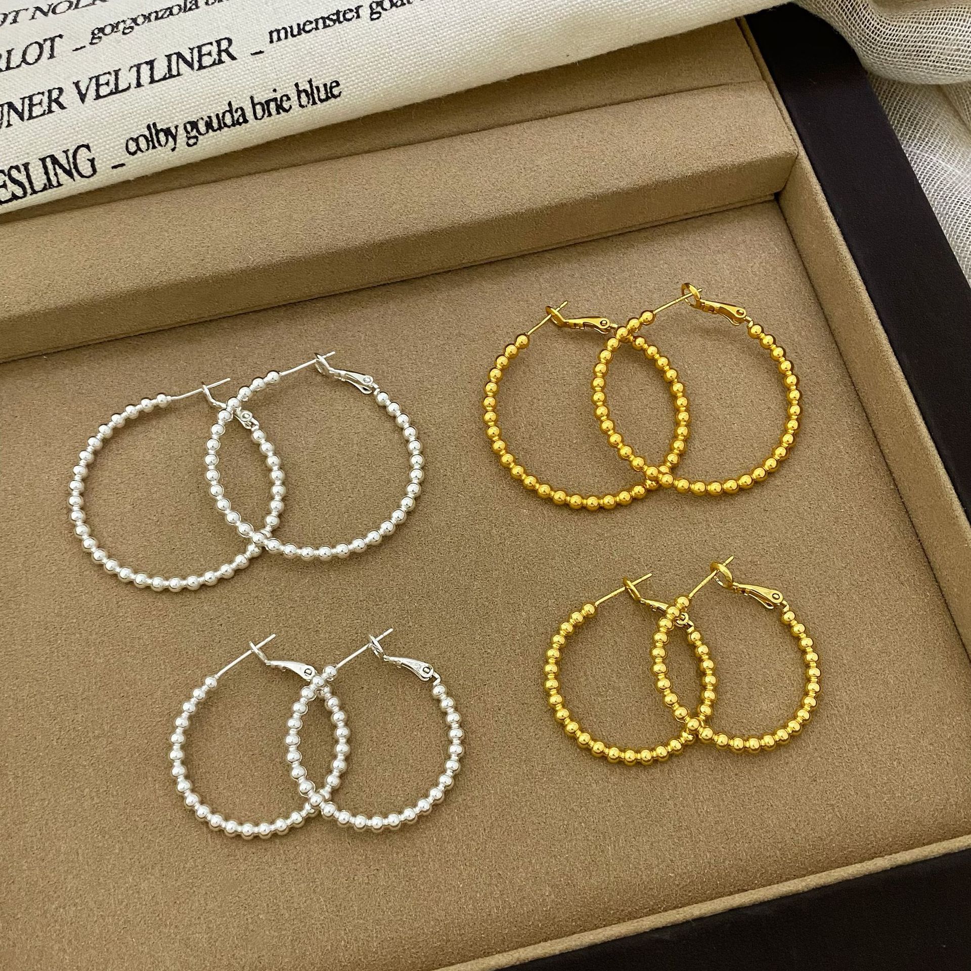 Copper plated with real gold, European and American style exaggerated small bead large hoop earrings for women, new cool and stylish hoop earrings