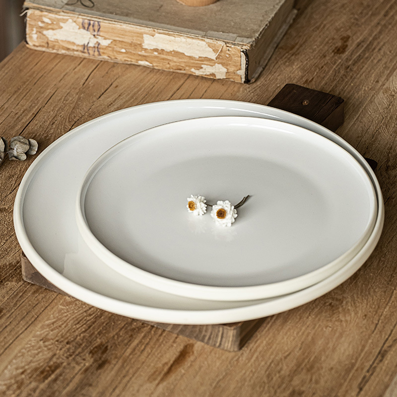 Plato de cerámica de disco minimalista nórdico Plato de verduras para el hogar Plato de postre redondo Plato de filete de restaurante Plato de vajilla al por mayor