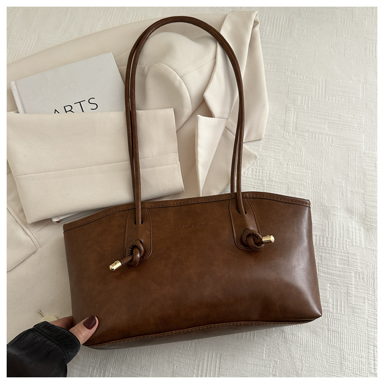 Commuting mujeres de color sólido 2024 nuevo otoño invierno retro moda texturas colgantes casuales de hombro bolso