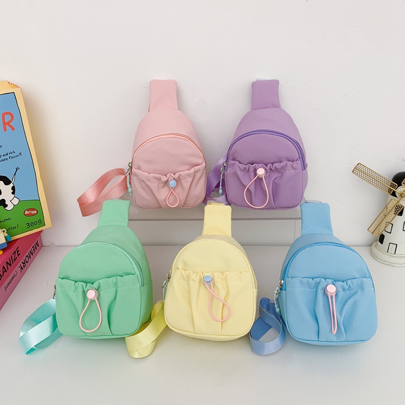 Bolso de pecho simple de color sólido para niños y niñas, bolso de ocio, bolso de mochila infantil ligero, 2026 nuevo bolso de cambio para niños