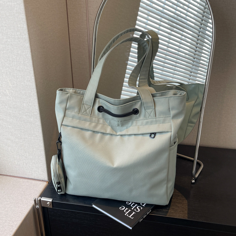 休闲大容量托特包包女尼龙布抽绳单肩包男女学生上课手提包通勤包