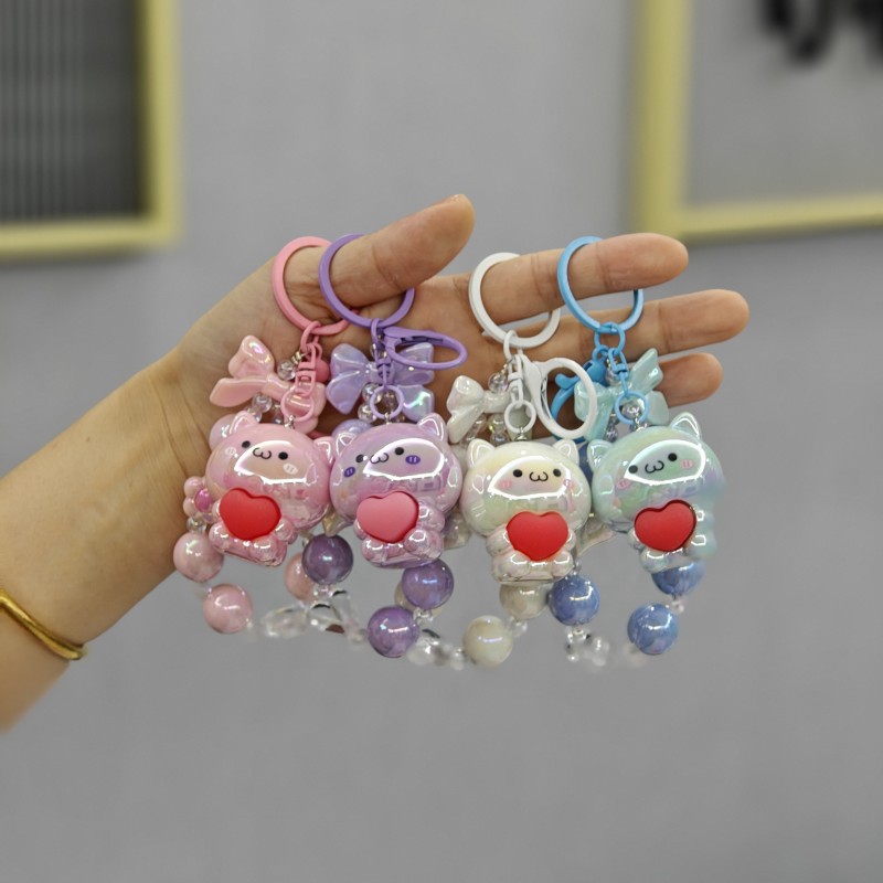 Galvanoplastia abrazo amor oso con cuentas llavero colgante acrílico muñeca colgante garra máquina muñeca regalo al por mayor