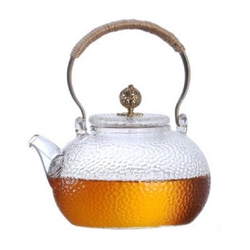 Fábrica al por mayor tetera de vidrio borosilicato hogar juego de té flor tetera de cobre martillado tetera fabricante de té