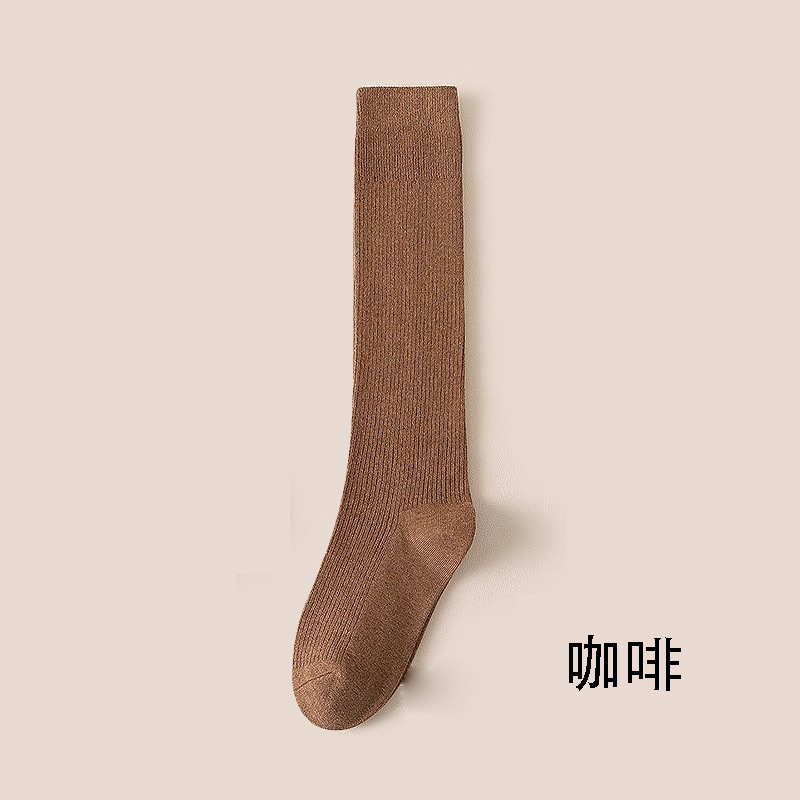 縦条のふくらはぎの靴下の女性の春秋の圧力の長い筒の靴下はやせていることができます。