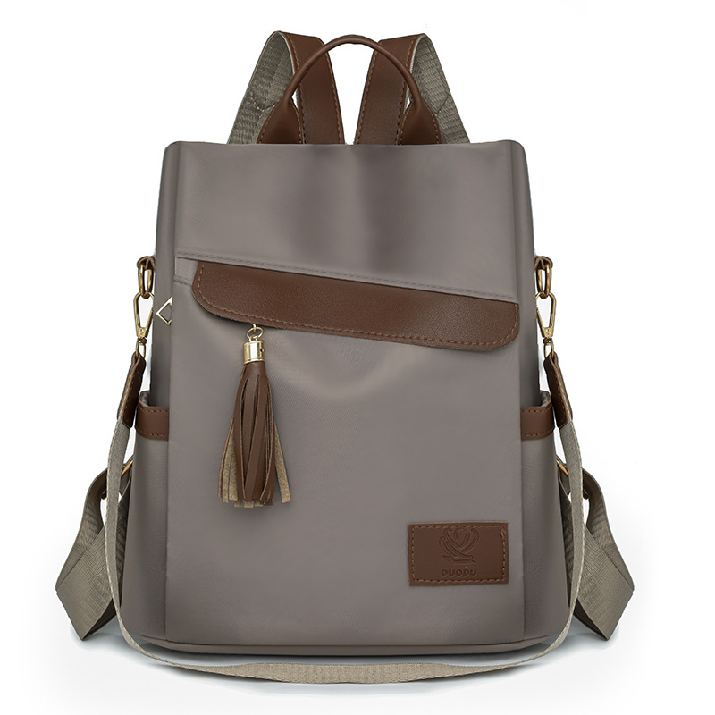 2024 otoño, nueva mochila antirrobo para mujer, borla de moda, color de contraste, nailon, mochila de viaje, mochila escolar, marea