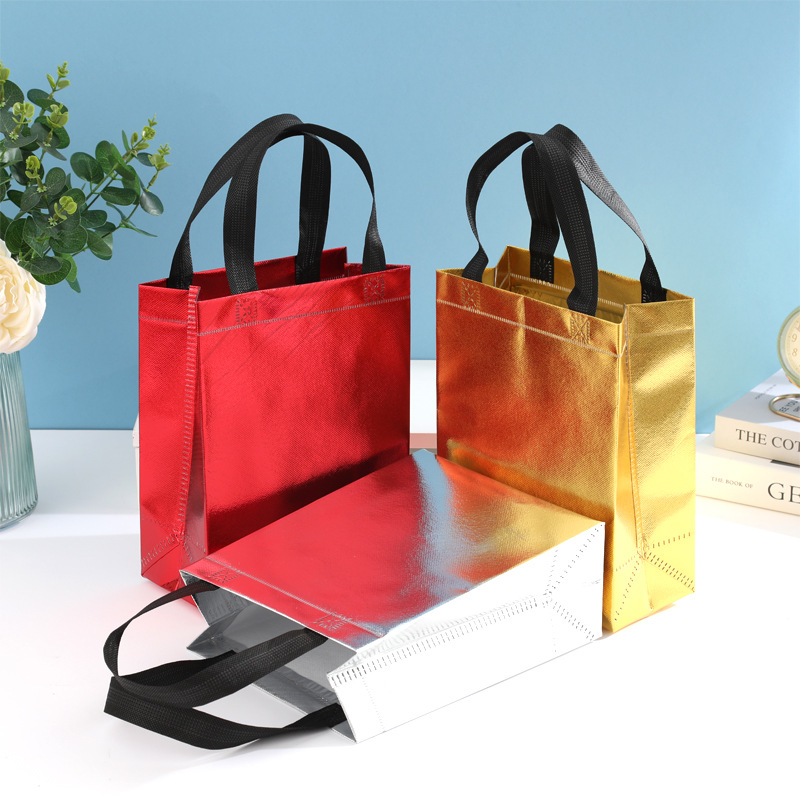 En stock nueva bolsa de regalo no tejida láser bolsa de regalo de boda bolsa de fiesta de comercio exterior logotipo imprimible