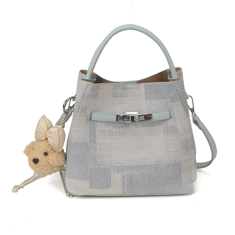 Comercio exterior transfronterizo coreano simple nicho de diseño de moda bolso de cubo para mujeres 2026 nuevo tipo de mujer mochila de hombro