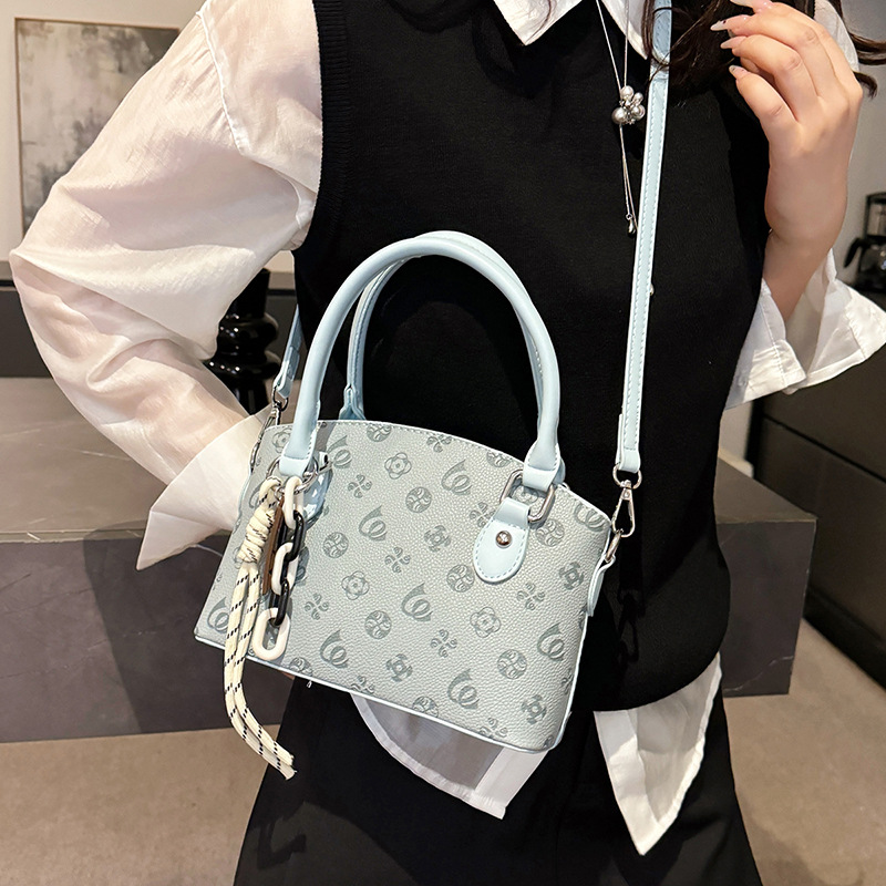 Bolso de textura transfronteriza 2025 verano nuevo estilo bolso de hombro con patrón de lichi bolso de mensajero en relieve de moda mujer