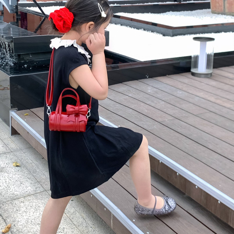 Bolso cilíndrico para niña de color sólido simple bolso de bebé con lazo dulce y lindo 2025 moda mini bolso para niños