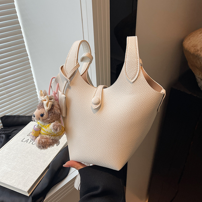 Bolso de cubo de canasta de verduras portátil de gran capacidad de alta calidad para mujer 2025 nuevo bolso de mensajero de hombro de estilo occidental de todo fósforo de moda