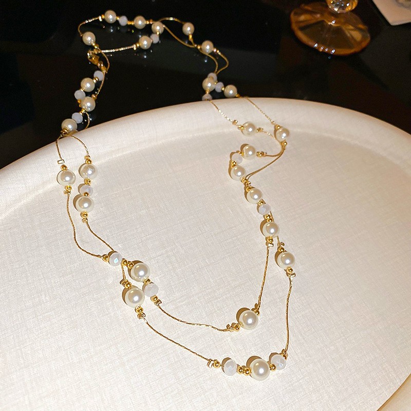 Collar con cuentas de perlas de gota de agua con diamantes transfronterizos otoño e invierno cadena de suéter de lujo ligero francés moda todo fósforo joyería de alta gama