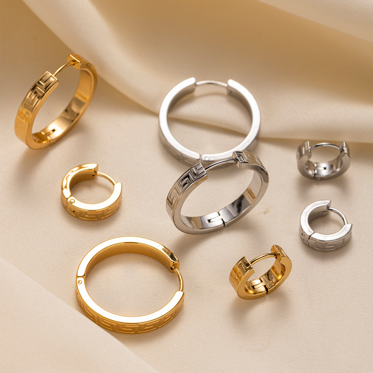 TENA Europa y América pendientes de acero inoxidable vacaciones nicho de diseño de textura de acero de titanio ligero lujo de alta calidad joyas para los oídos