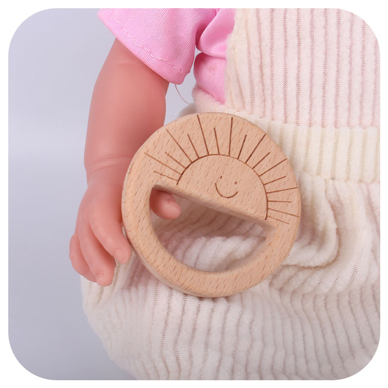 Nuevo bebé suministros juguete de haya mordedor bebé molar mordedor pulsera DIY Smiley sol láser talla