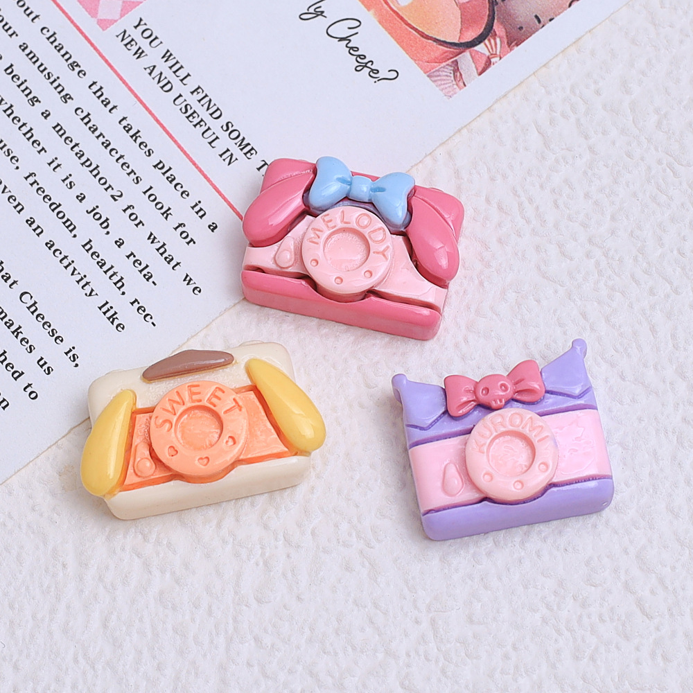 Dibujos animados pequeña cámara transmisión en vivo caliente DIY pegamento crema teléfono móvil Shell joyería accesorios de resina horquilla al por mayor
