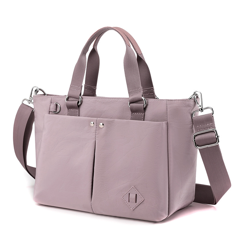 Nuevas tendencias de moda en 2025 bolsos de hombro de varias capas bolsos de hombro de gran capacidad para viajar y evitar salpicaduras de agua mochilas de versión coreana