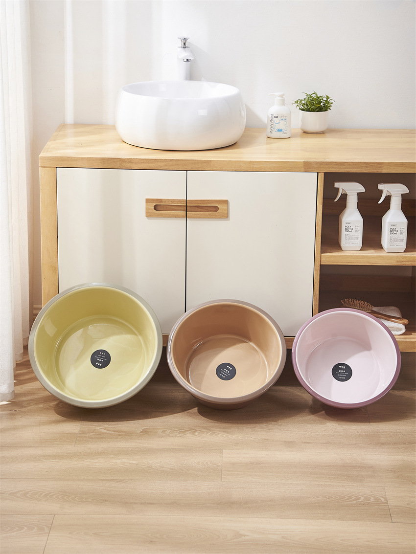 Two-color plastic washbasin for home use