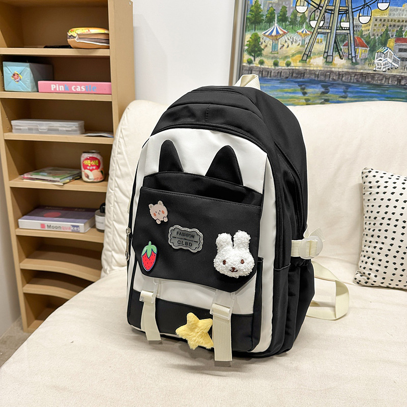 La versión coreana de las mochilas escolares de doble hombro está llena de mochilas escolares de primaria y mochilas escolares de tendencia de la escuela secundaria de gran capacidad.