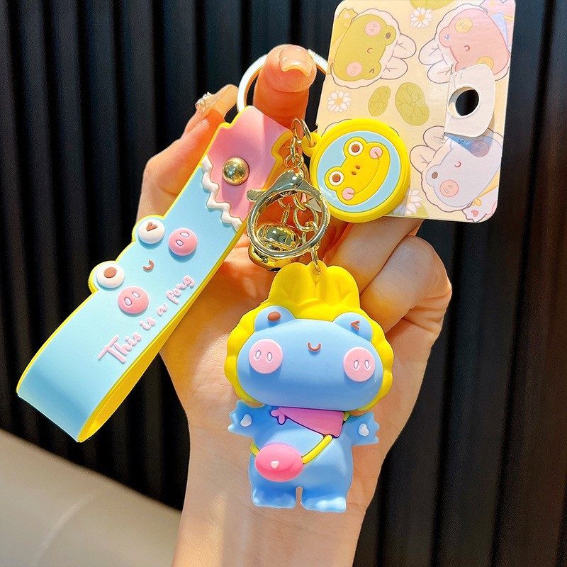 Keychain dinosaurio auténtico lindo bolso colgante de goma blanda llavero de automóvil muñeca pequeña máquina de regalos al por mayor image 31