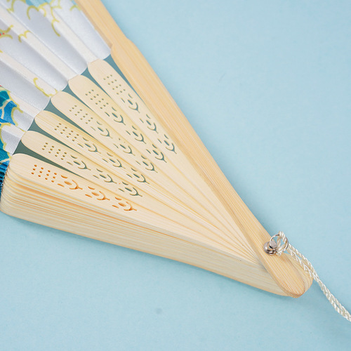 Fan wholesale 7-inch Chinese style women's tassel portable ancient costume Hanfu cheongsam folding fan bamboo fan big smile fan