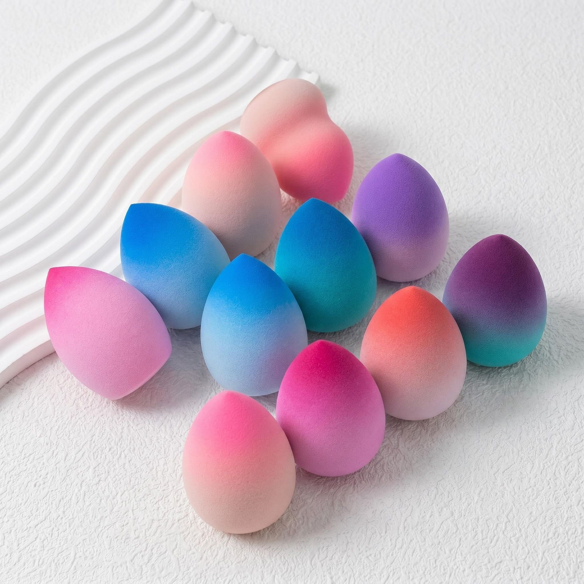 Fábrica personalizada huevo de maquillaje gradiente super suave no comer polvo seco y húmedo doble uso de agua gota de maquillaje huevo al por mayor