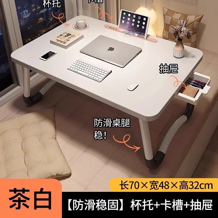 折り畳み可能なベッドの上の小さなテーブルは机のノートパソコンのテーブルを勉強します。|undefined
