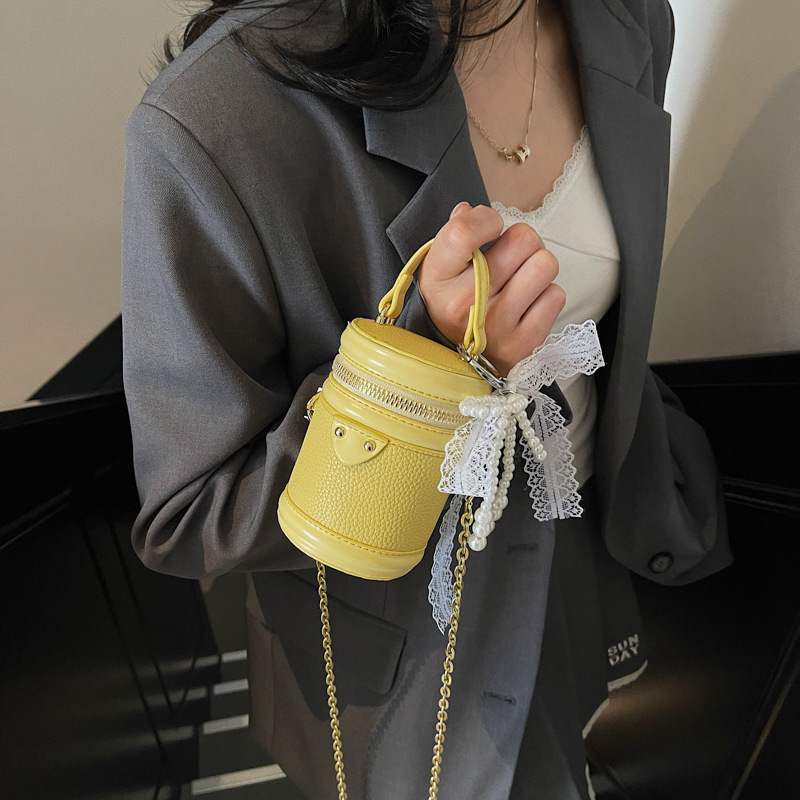 Transfronterizo de alta calidad moda mini bolso de cubo portátil para mujeres 2025 nuevo nicho de diseño universal mochila de hombro