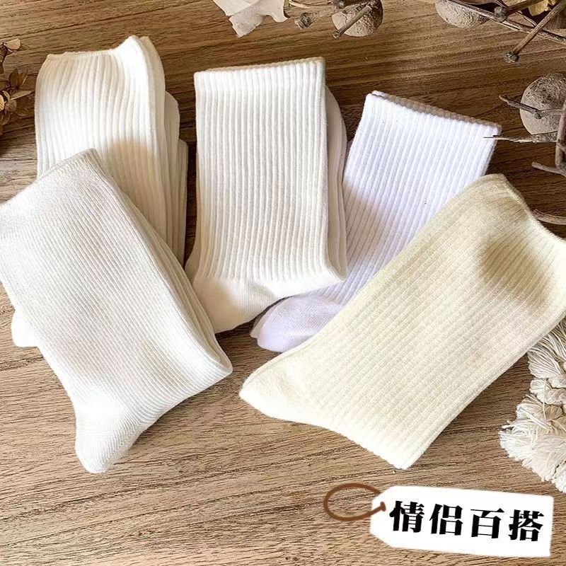 Socks ladies spring and autumn socks women in the tube solid color boneless pile socks wholesale factory disposable socks