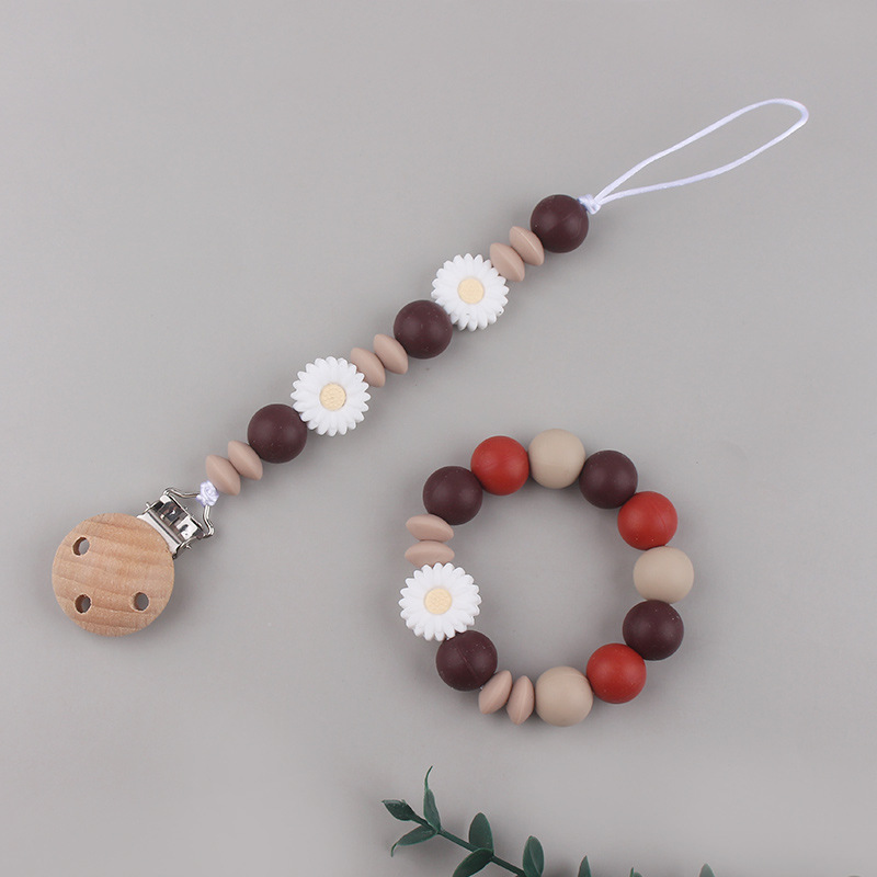 Nueva margarita pequeña cadena de tetina para calmar a los bebés anti-caída cadena creativa DIY pulsera de goma de diente dos conjuntos