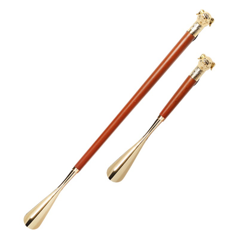 Fábrica en stock Zodiaco cabeza de cerdo de metal zapato extractor conveniente zapato dispositivo de elevación bomba de zapatos