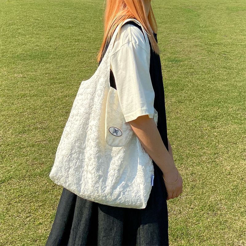 懦夫救星星白色托特包小众腋下包夏女学生上课通勤帆布袋单肩包包