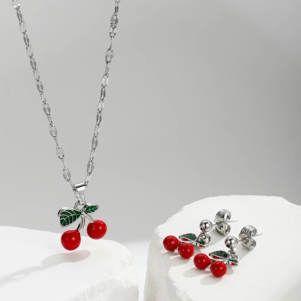 Explosiones transfronterizas coloridas cereza roja pintada a mano goteo de frutas series de joyería simple colgante de viento conjunto de aretes collar