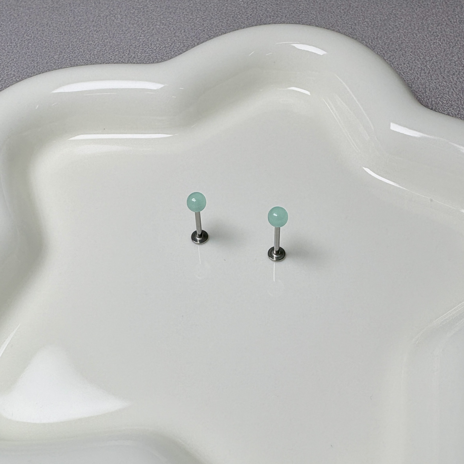 Silver pointed spike labret stud material detail