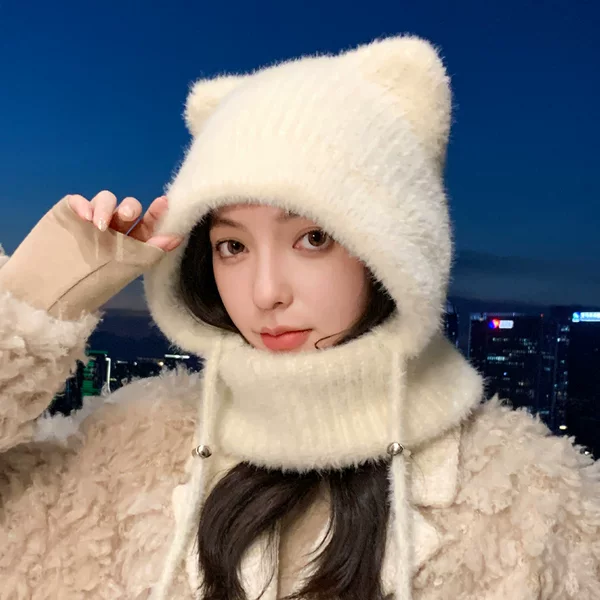 Korean-style cute cat-ear balaclava, a warm and windproof winter hat for women, featuring an integrated knitted scarf