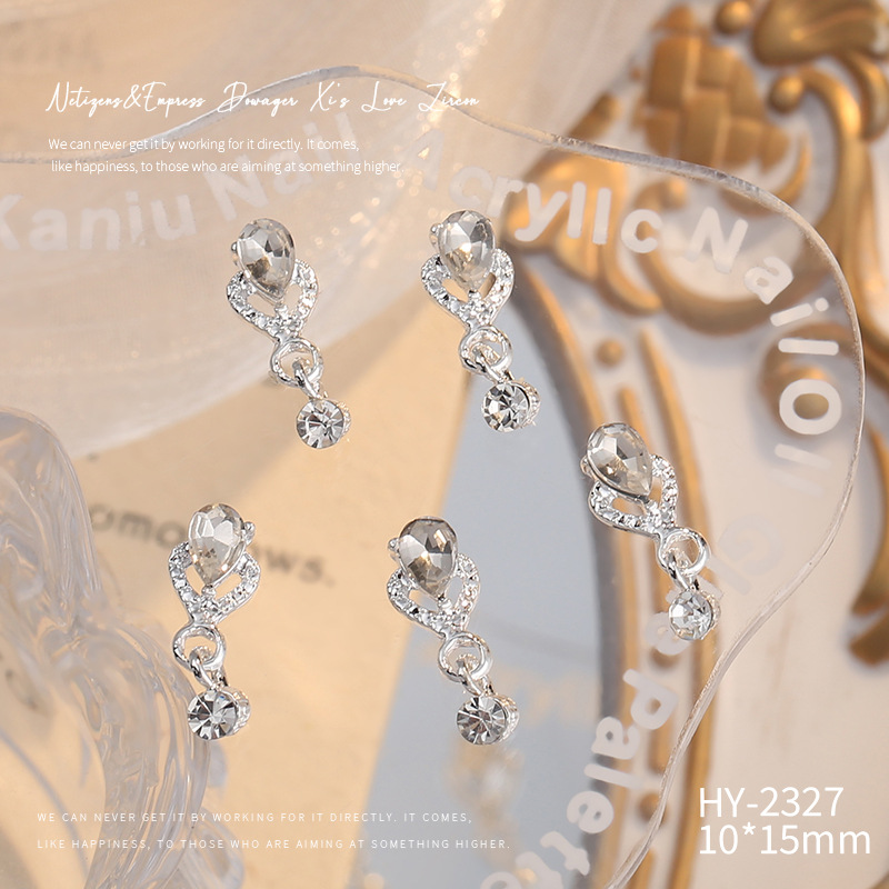 Nueva joyería de aleación de manicura completa diamante borla arco corona plata uñas manicura joyería accesorios al por mayor