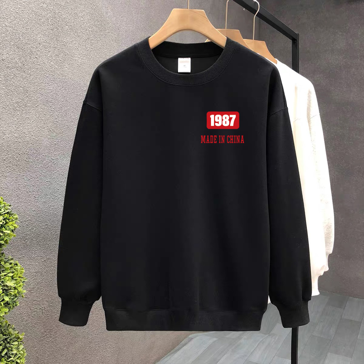 Suéter de algodón negro pesado de alta gama para mujeres 2025 otoño y invierno nuevo estilo europeo y americano camiseta de manga larga fondo suéter de estudiante