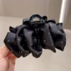 Black satin polka dot cloud clip