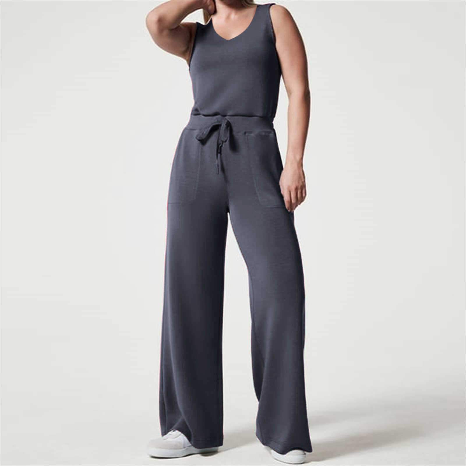2023 primavera y verano nuevo versátil moda europea y americana adelgazamiento ocasional de las mujeres sin mangas color sólido V-cuello pantalones jumpsuit