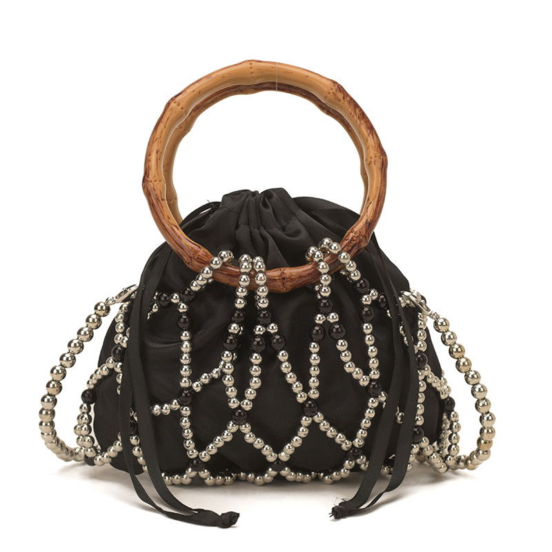 Nueva bolsa china de tejido para niños y niñas bolsas de hombro de perlas de bambú hueco bolsas de mano pequeñas bolsas de cuerda de dibujo para niños