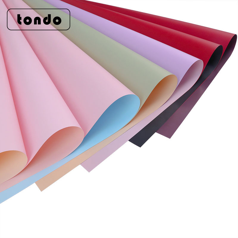 Papel de regalo de flores al por mayor de doble cara de dos colores de segunda generación Ouya papel engrosado impermeable ramo de flores frescas papel de regalo material de bricolaje