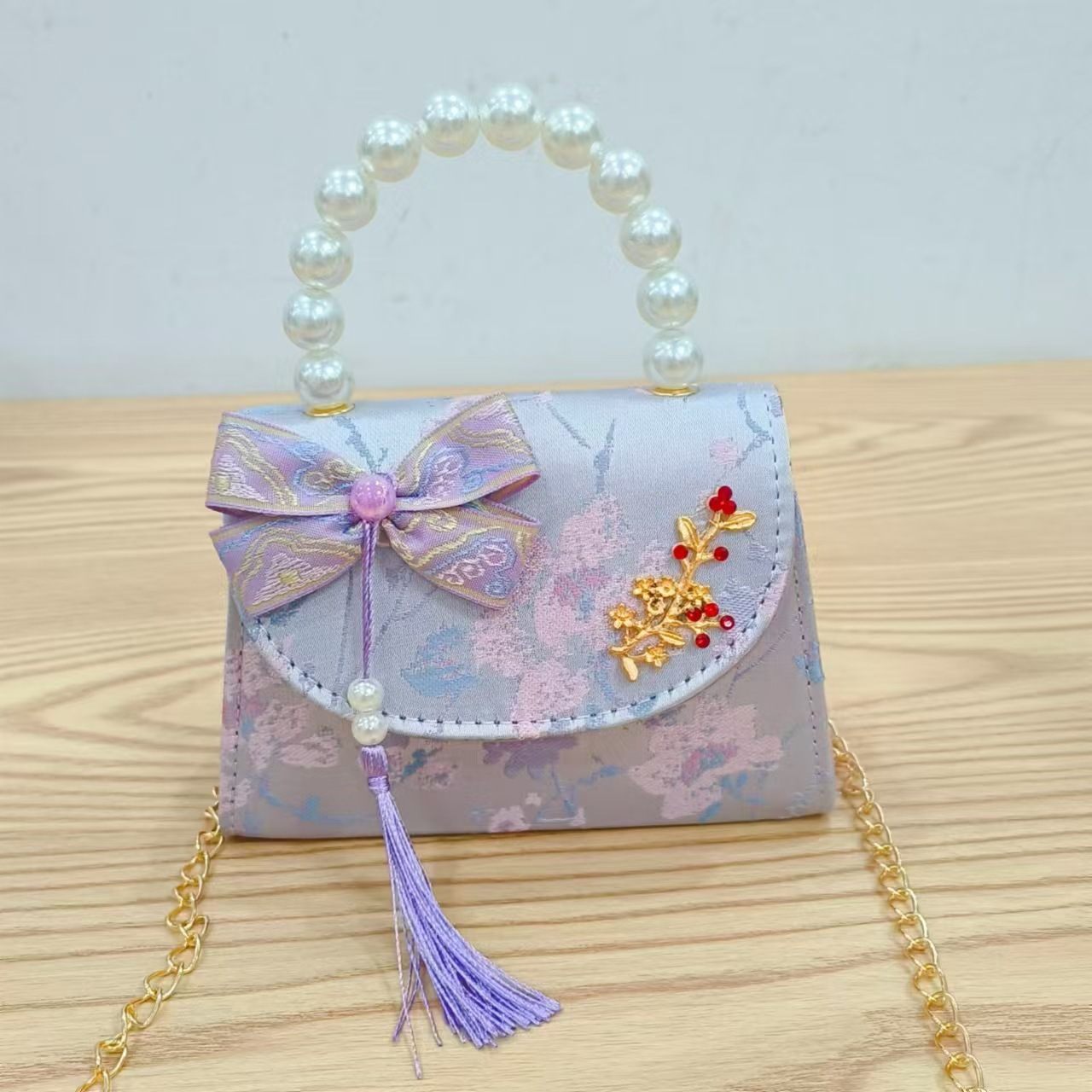 Bolsas de niños arco de estilo chino borda de niña pequeña princesa perla bolsa de cambio de mano al por mayor