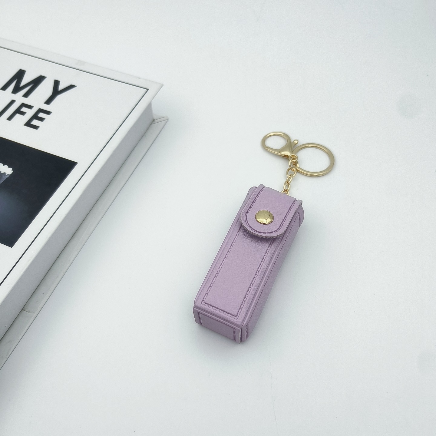 Bolso de cambio transfronterizo sobre rojo espejo creativo llavero colgante pequeño PU cuero bolso de coche accesorios accesorios en stock