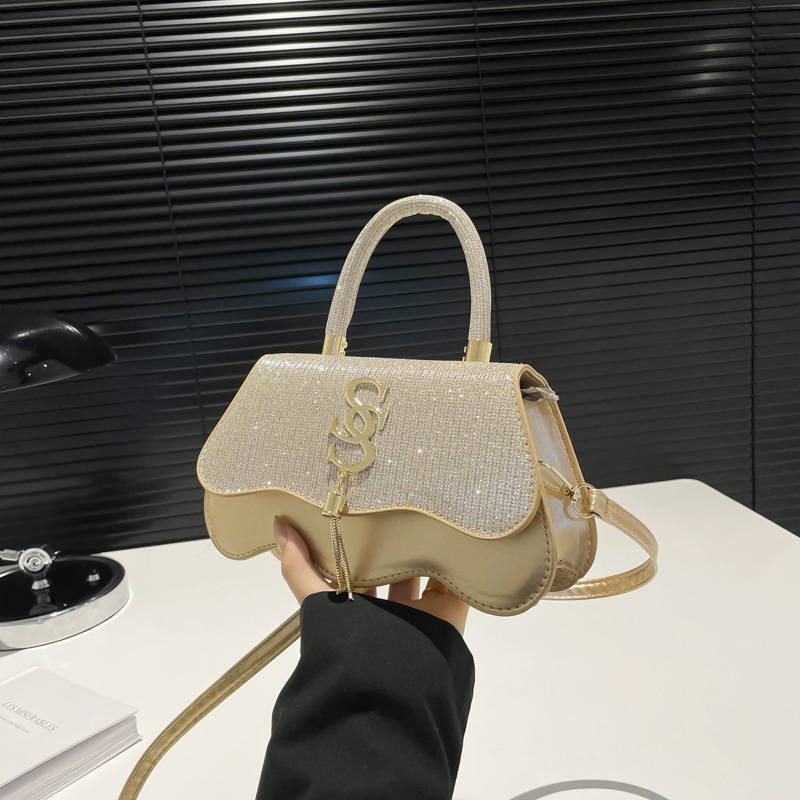 Bolsos cuadrados pequeños portátiles casuales Bolsos pequeños retro de moda para mujer 2025 primavera nueva moda casual popular bolso de mensajero