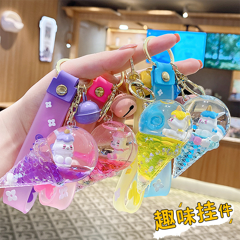 Llavero de unicornio transfronterizo para mujer, exquisito y lindo colgante de botella de arena líquida de cristal con forma de helado, accesorio para mochila, pequeño adorno.