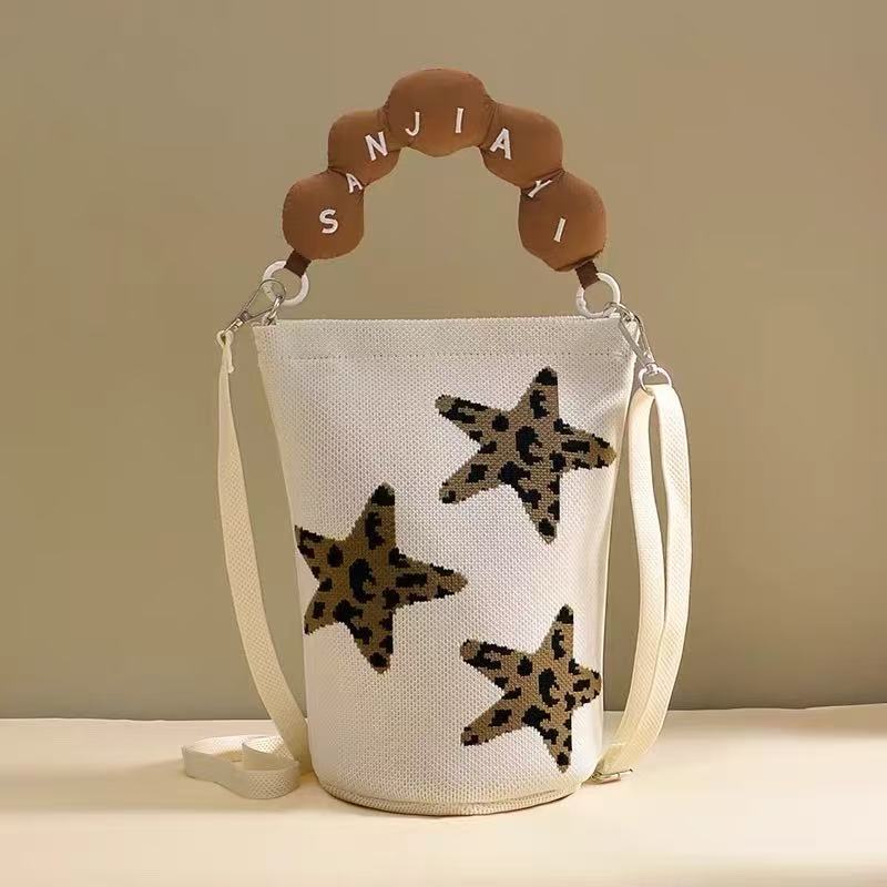 2026 primavera y verano nuevo bolso de cubo de pintura creativo portátil gran espacio de aire de dopamina alta sensación mochila