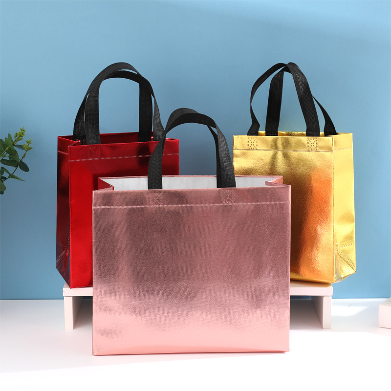 En stock nueva bolsa de regalo no tejida láser bolsa de regalo de boda bolsa de fiesta de comercio exterior logotipo imprimible