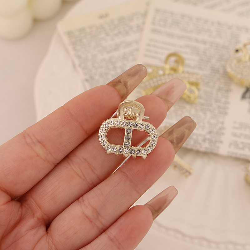 Clip pequeño semicircular doble dorado